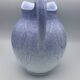 Blue glazed terracotta pitcher with hand-painted decoration, signed