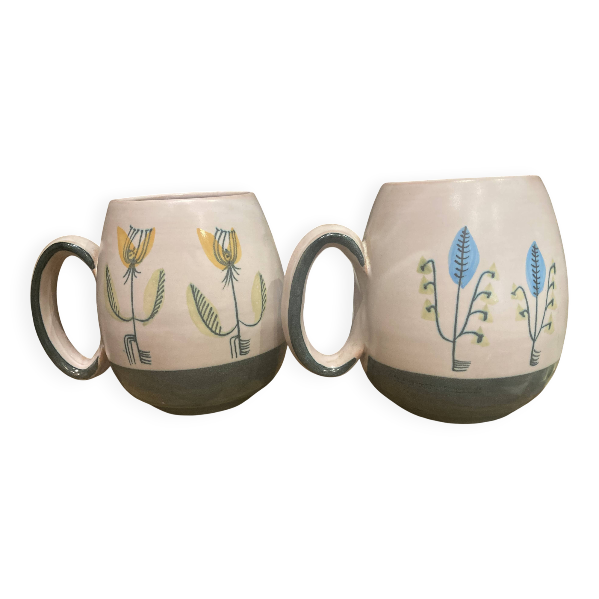 Set of two ceramic mugs signed Yvon ROY
