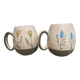 Set of two ceramic mugs signed Yvon ROY.