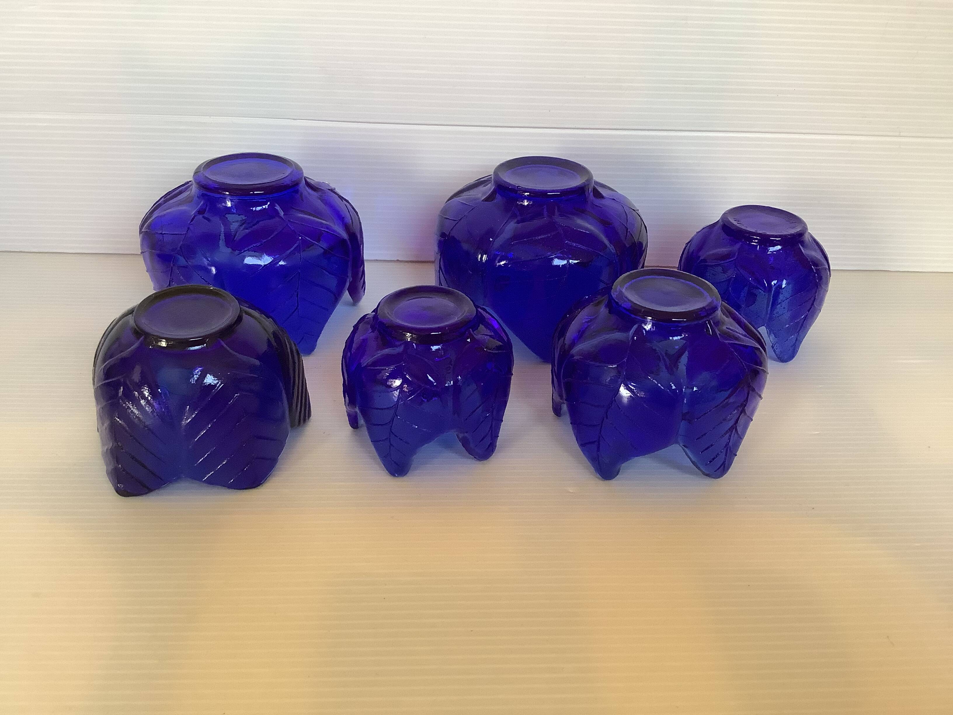 Six stackable cobalt blue candlesticks