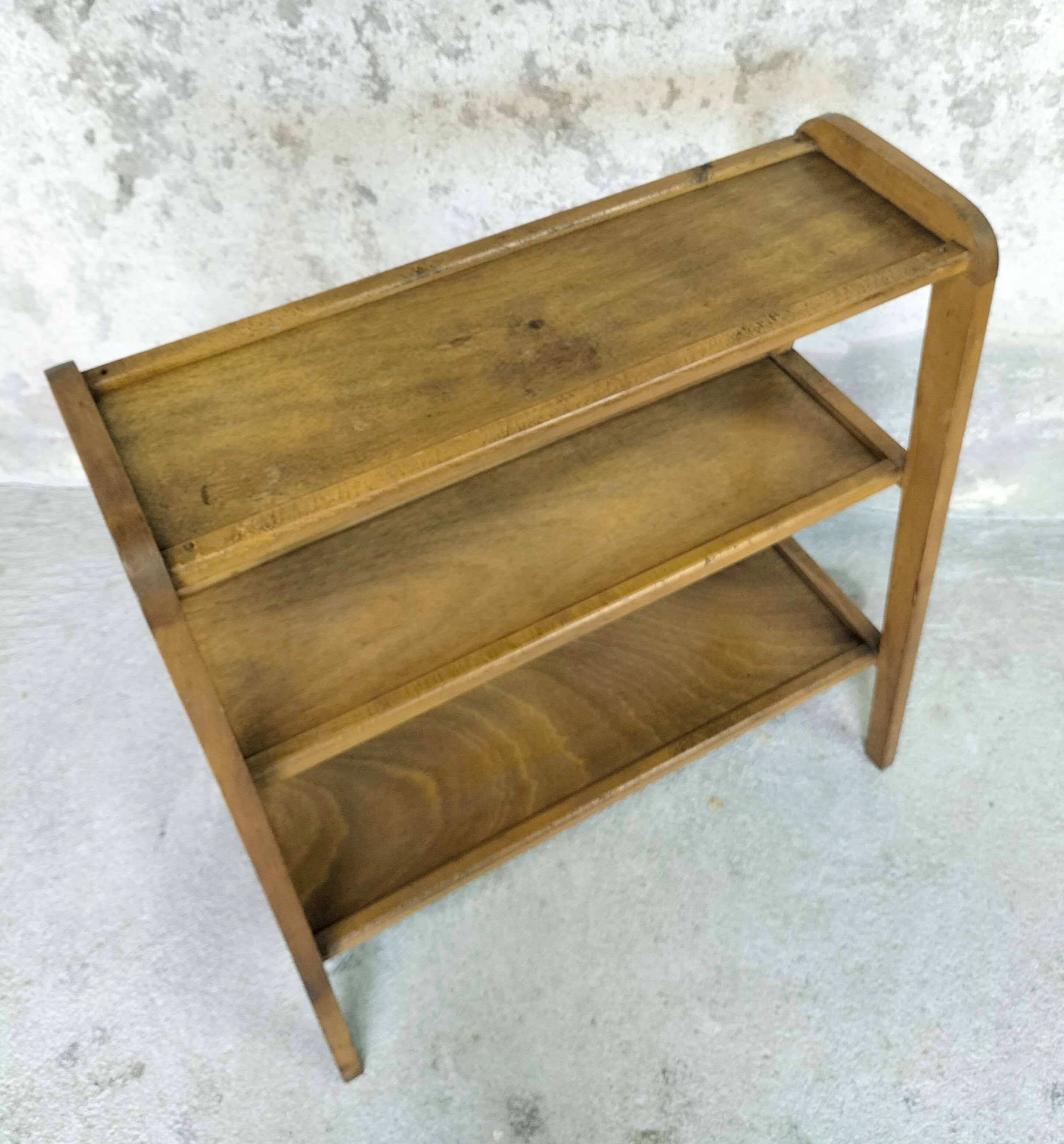 Vintage shelf on wooden legs in wood