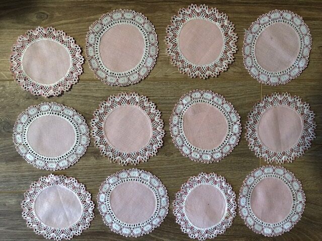 11 pink hand-lace coasters