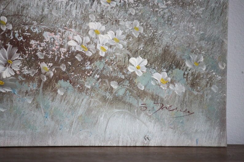 Painting on canvas flowers in meadow
