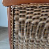 Armchair in woven rattan and exotic wood