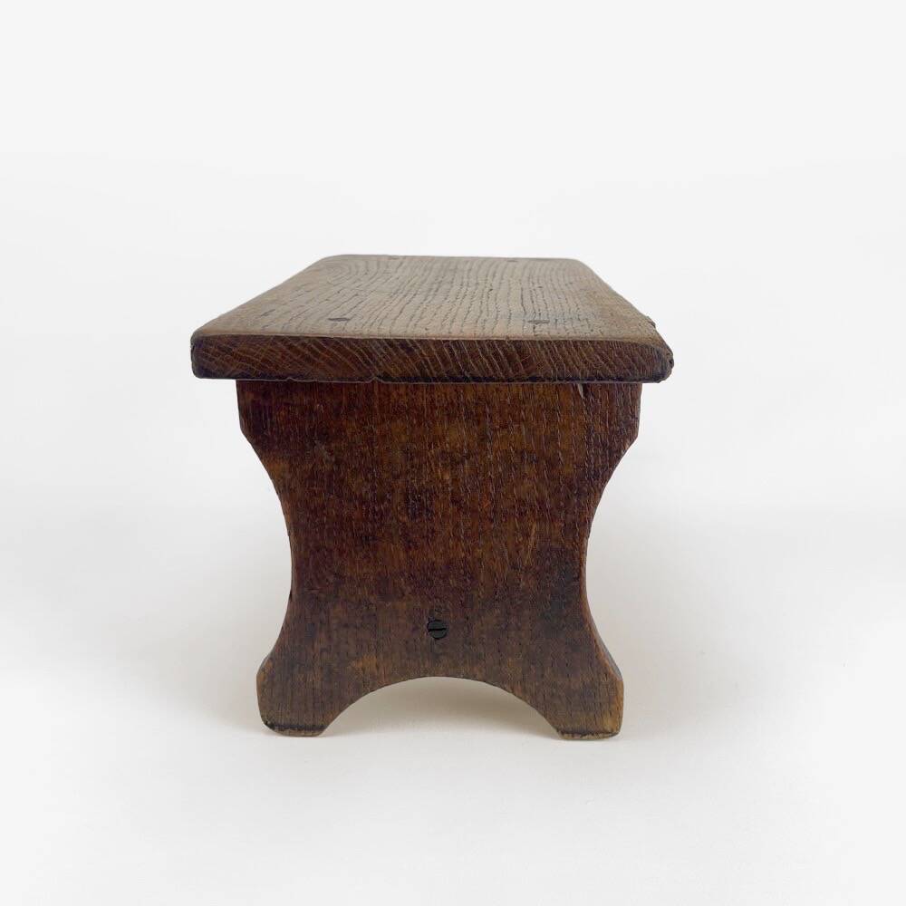 Small old wooden bench or footstool