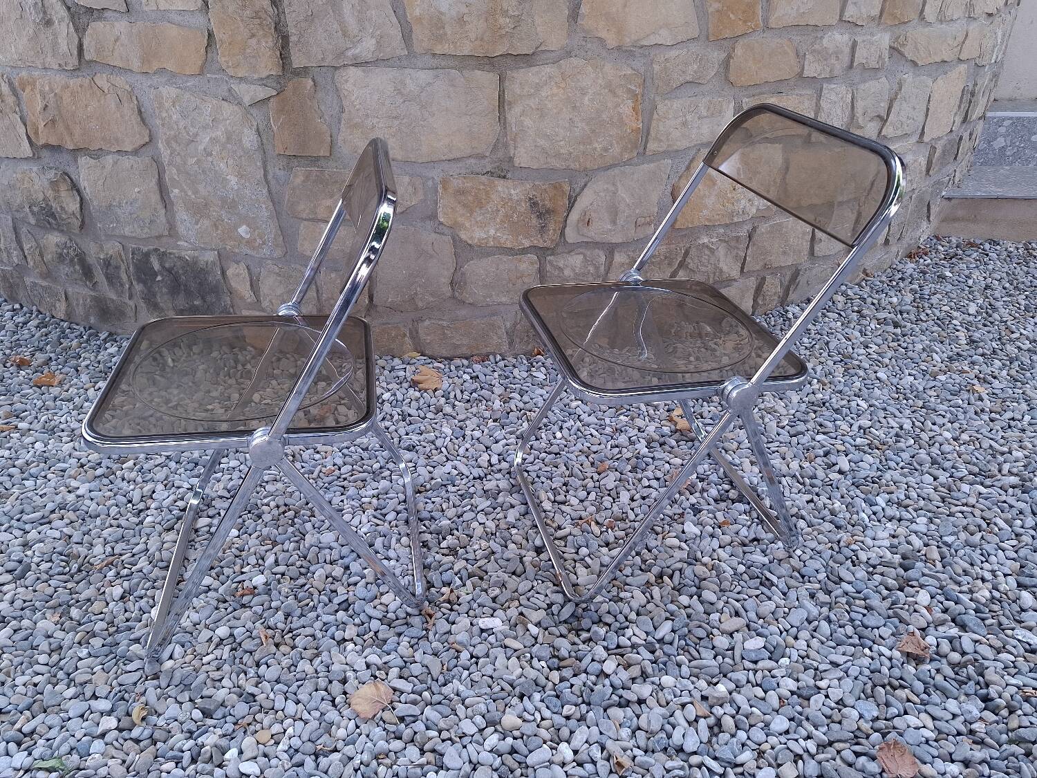 2 folding chairs designed by Giancarlo Piretti for Castelli