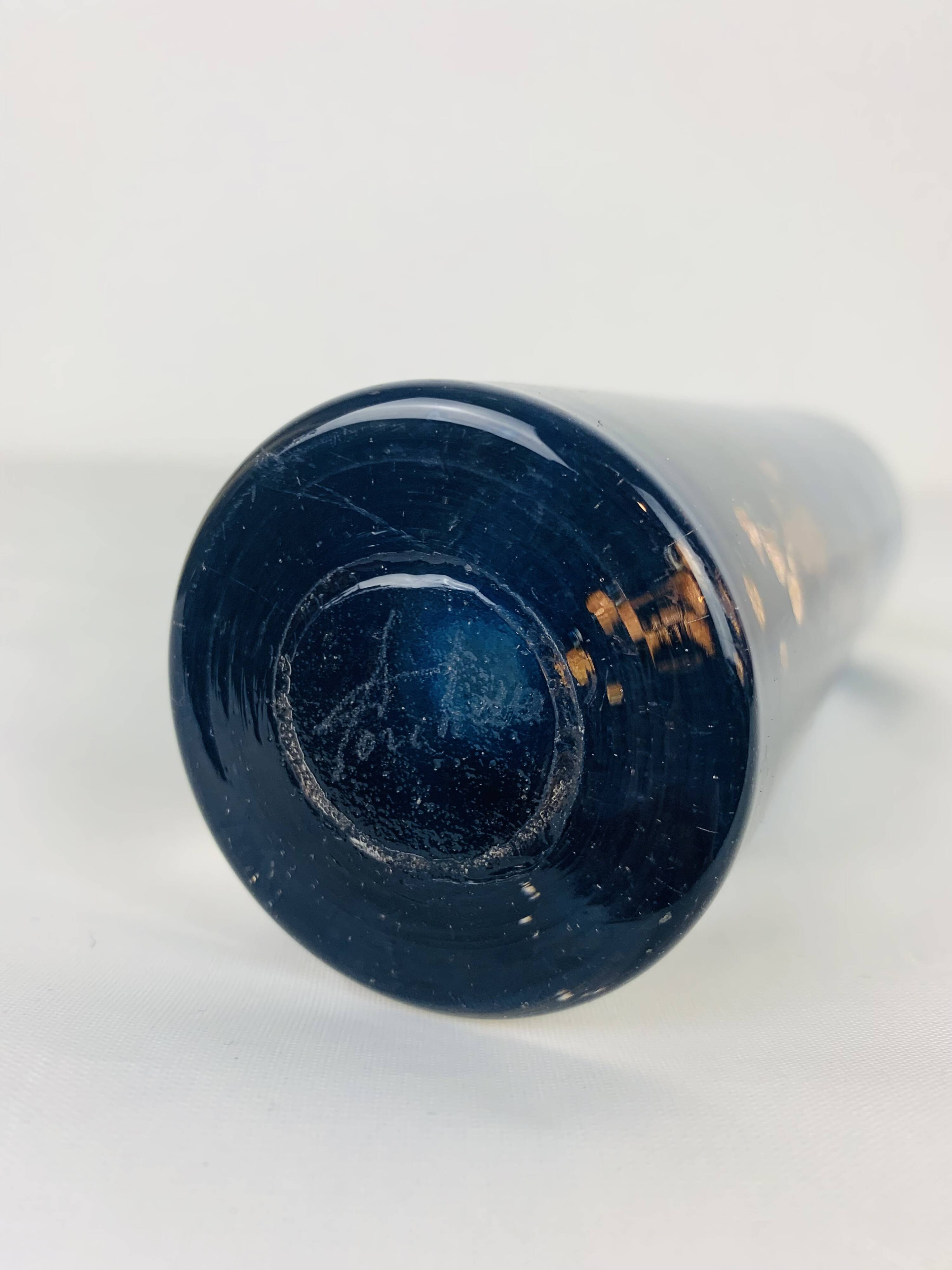 Vintage blue glass roller vase