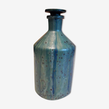 Apothecary bottle in polished glass glazed green tones