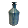 Apothecary bottle in polished glass glazed green tones