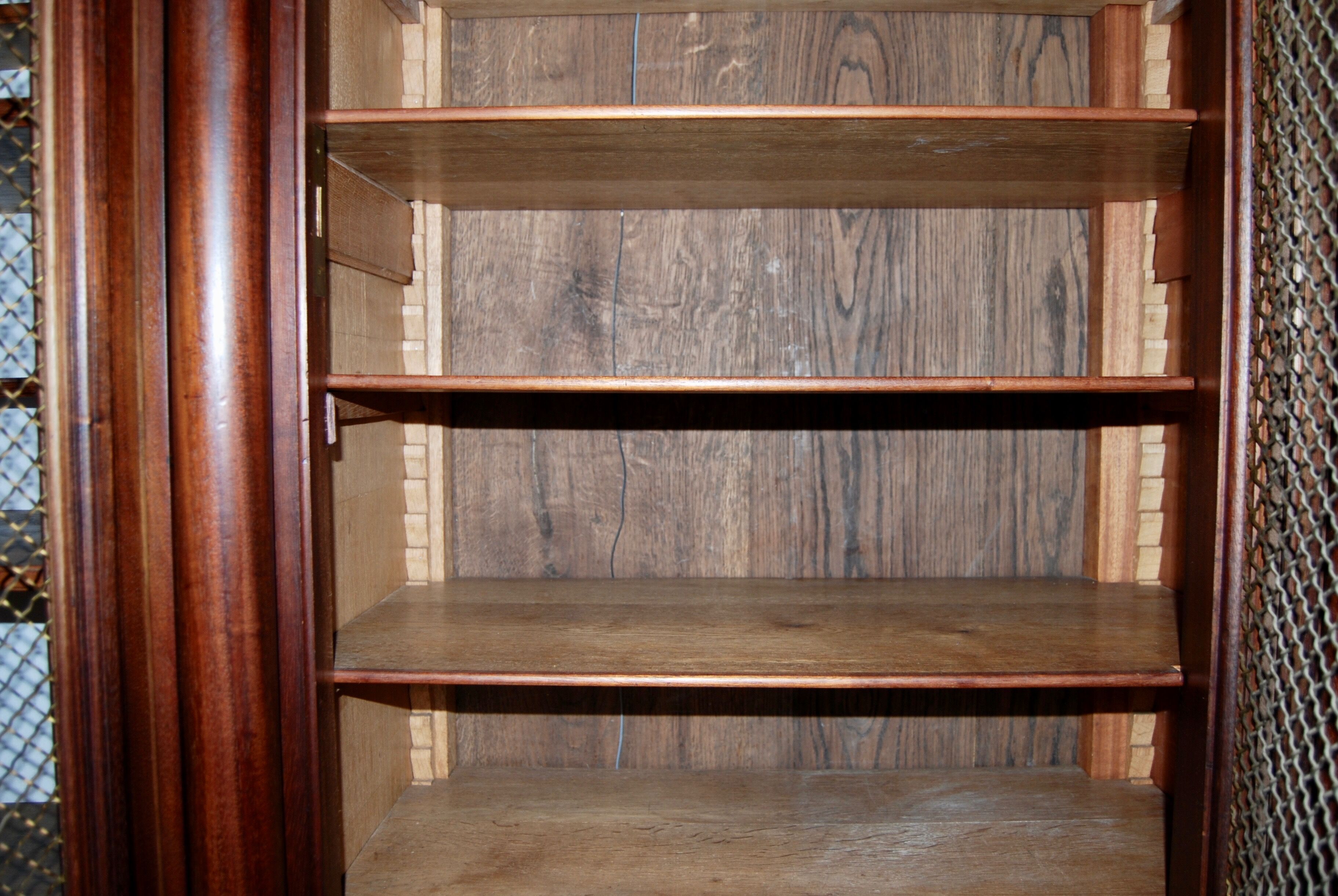 Large Empire library in solid mahogany, late nineteenth century