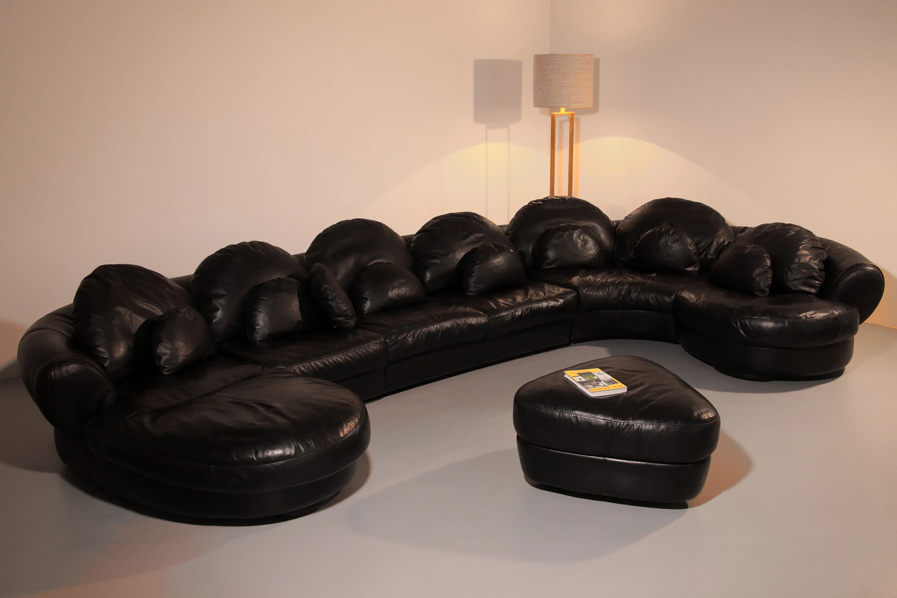 Organically shaped post-modern sectional sofa in black leather