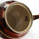 Old brown glazed ceramic coffee pot