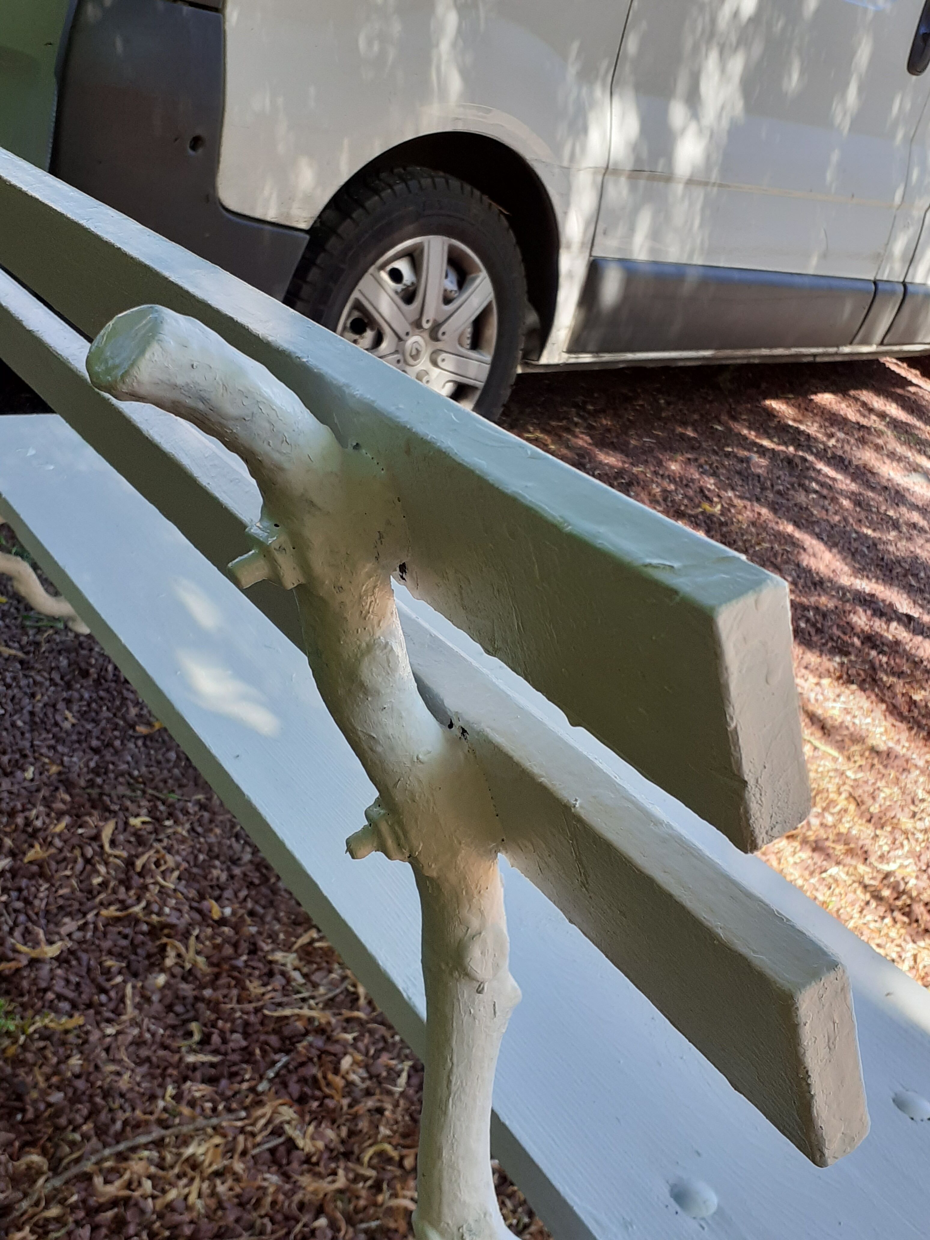 Old garden bench with cast iron feet and wooden planks