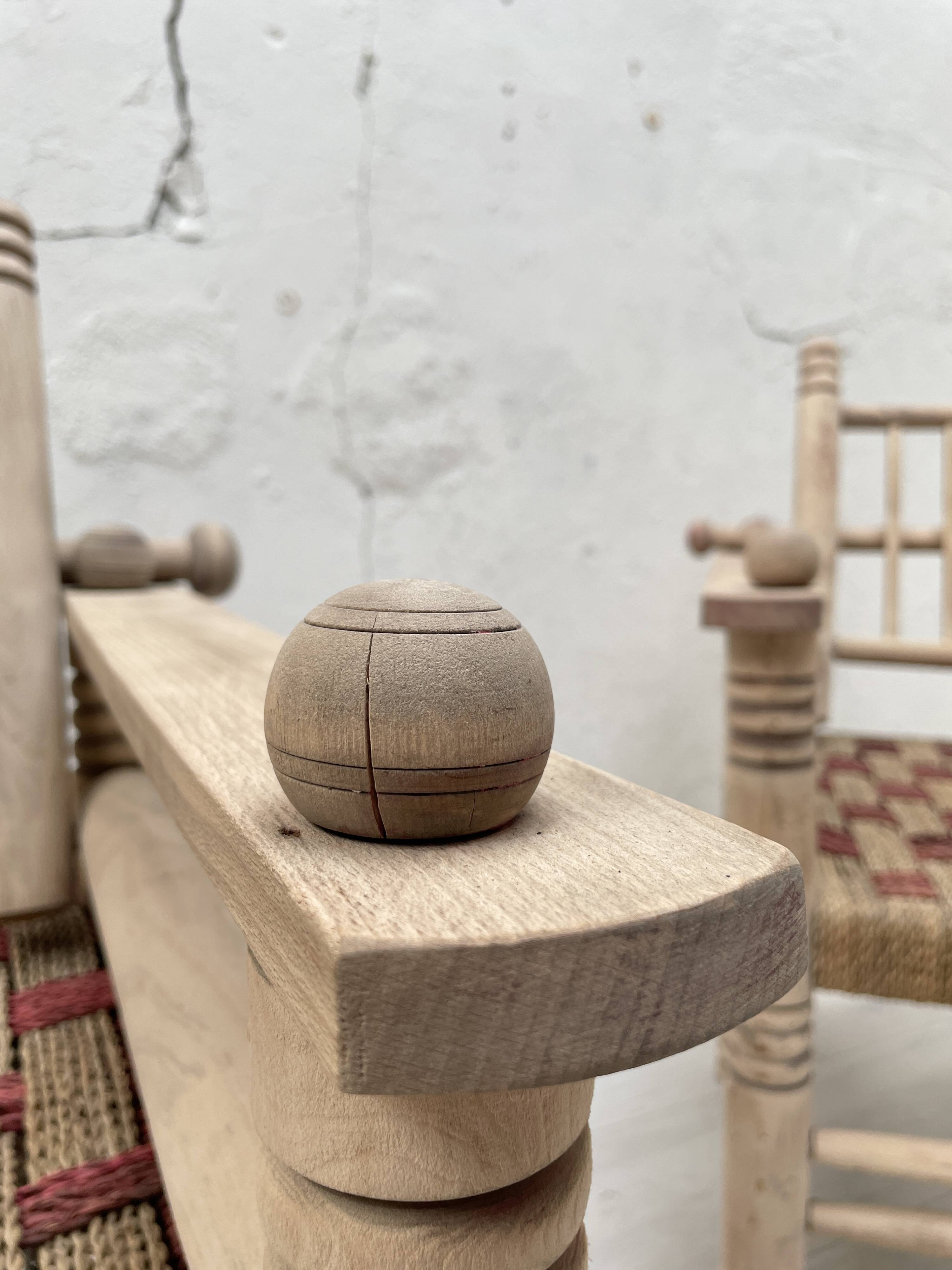 Pair of wooden armchairs and ropes