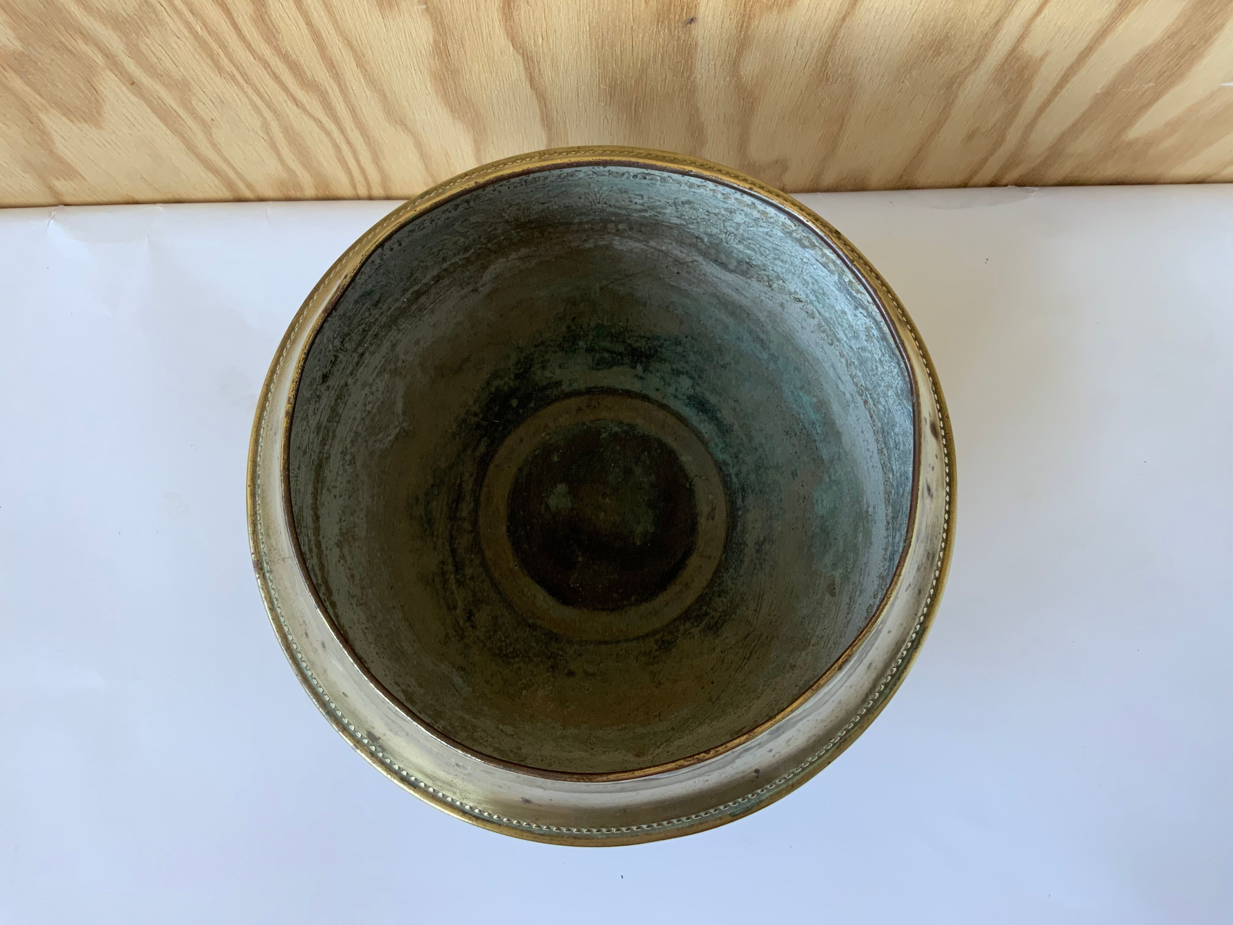 Brass pot cover