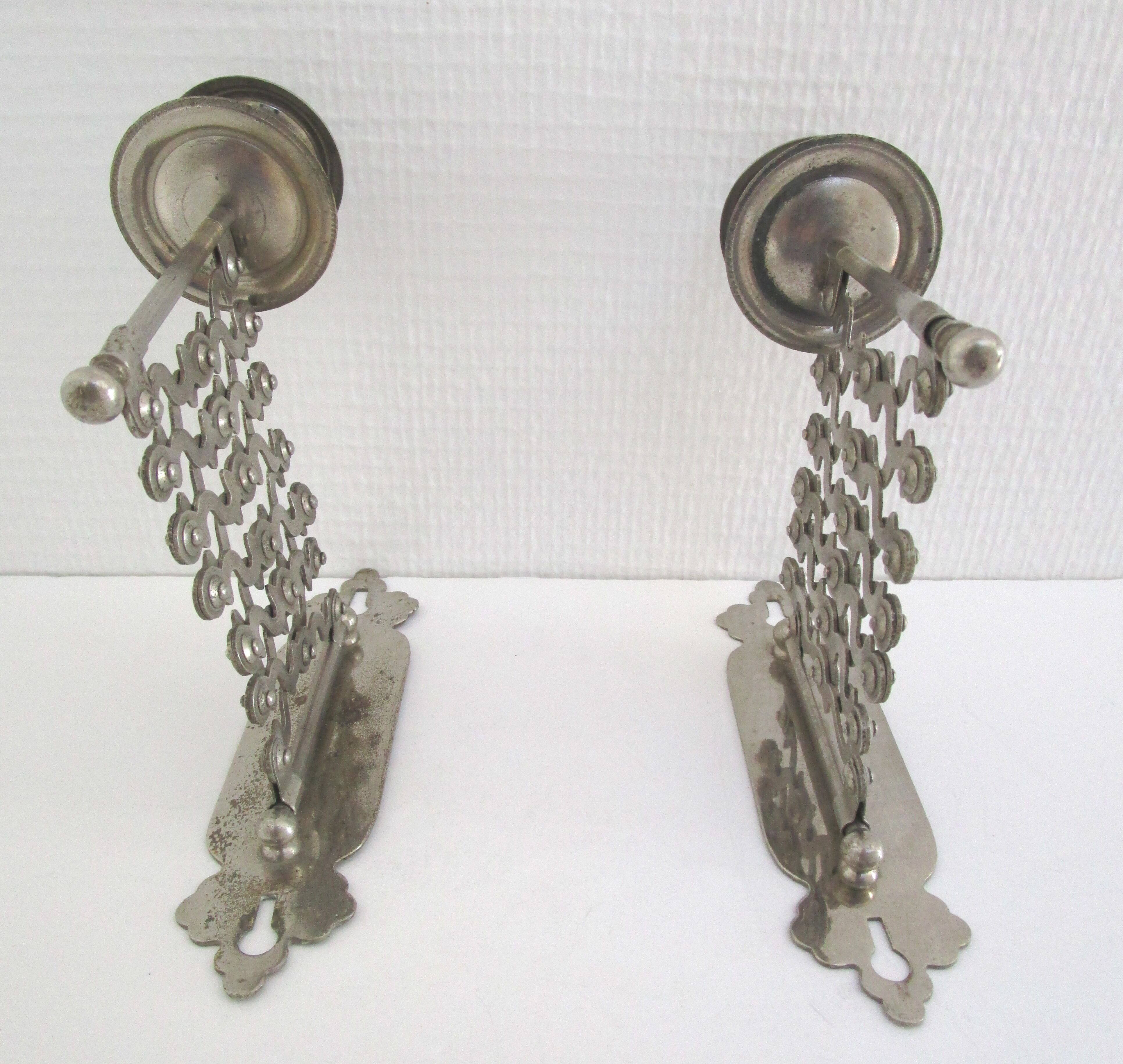 Pair of extendable old metal candlesticks