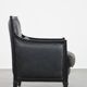 Armchair in black cowhide leather and wood with an Art Deco design