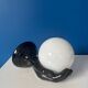 Vintage wall sconce with black hand and white opaline glass globe, 1970s L