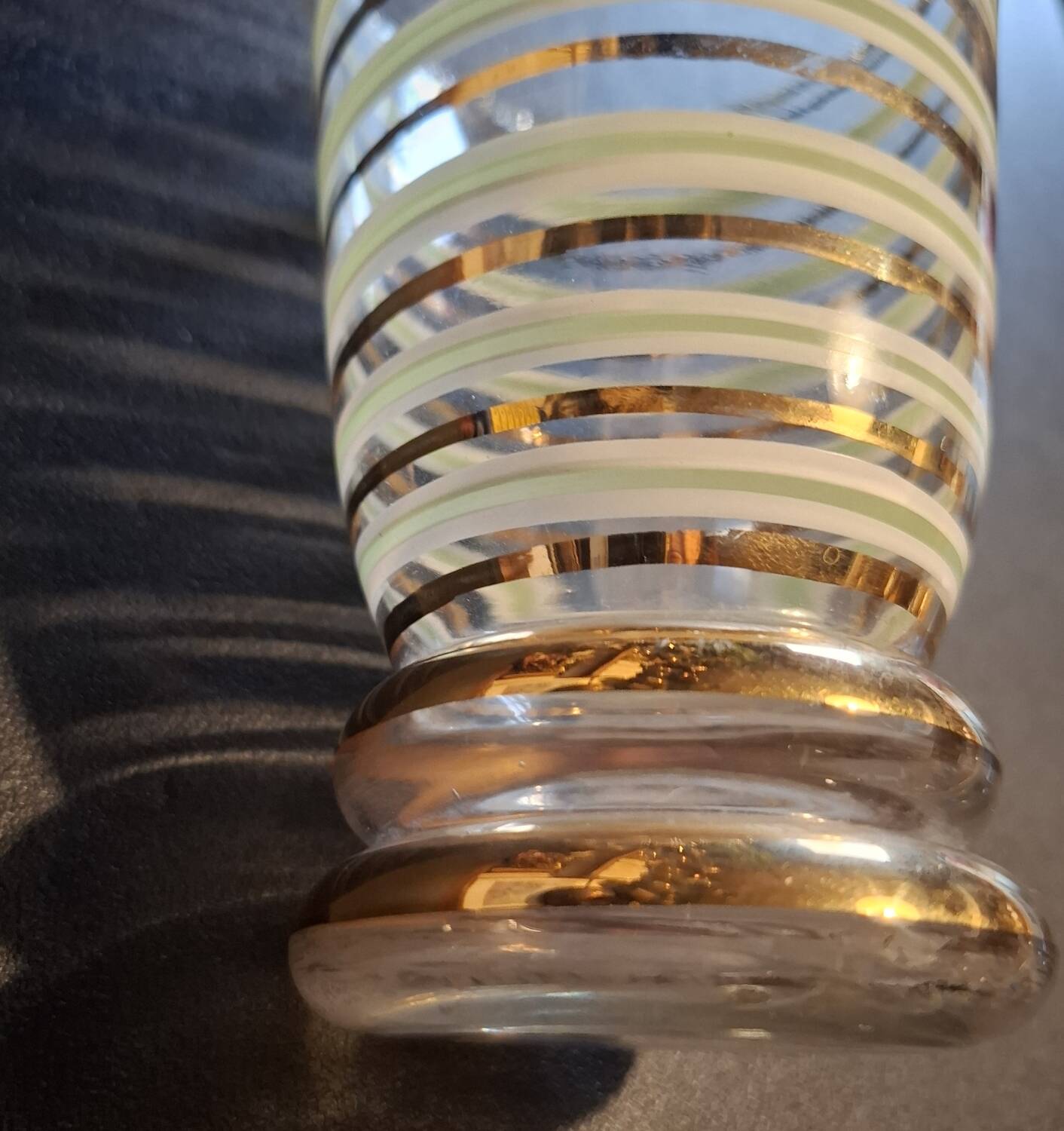 Vintage vase with green and gold trim.