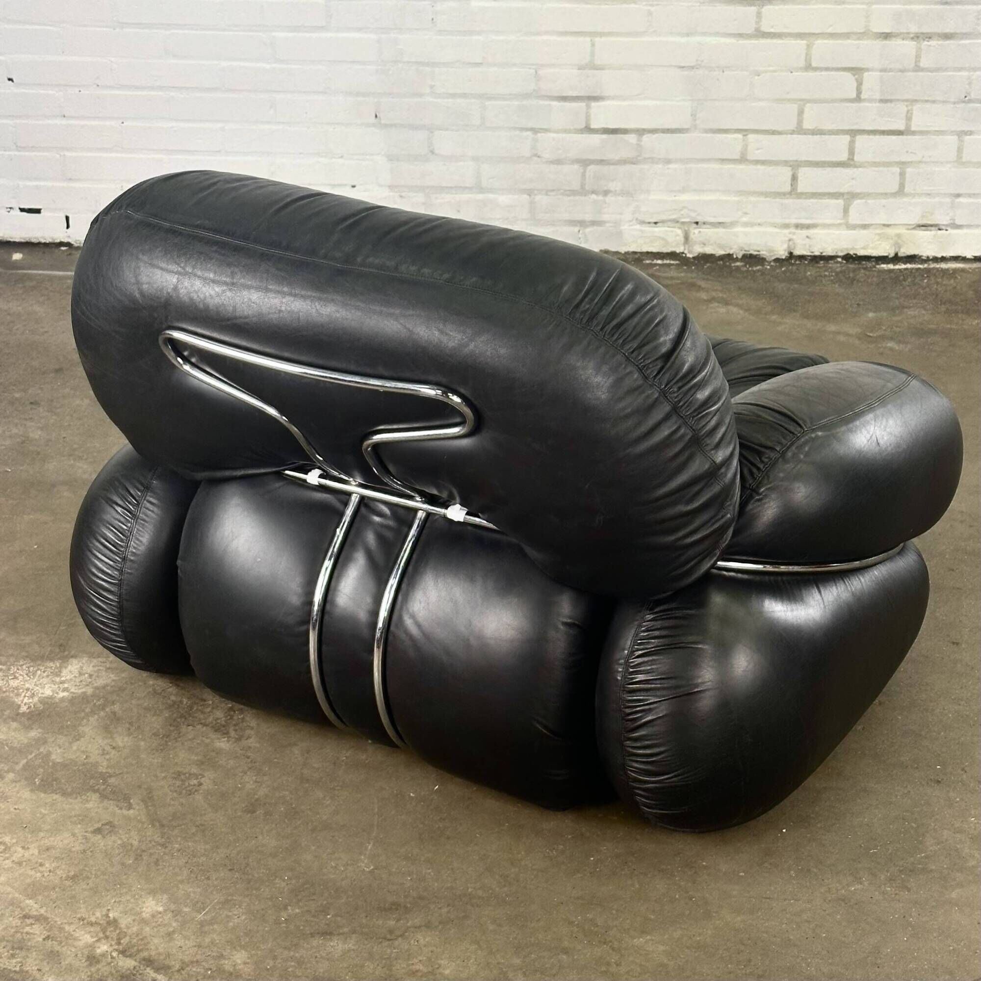 Okay armchair by Adriano Piazzesi in black leather with ottoman