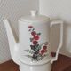 Small coffee maker with floral decoration