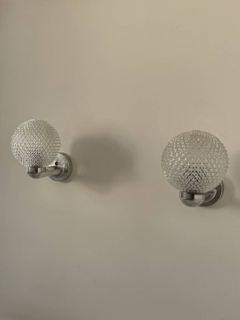 Pair of vintage wall lights in chrome metal and pressed moulded glass, France, 70s.