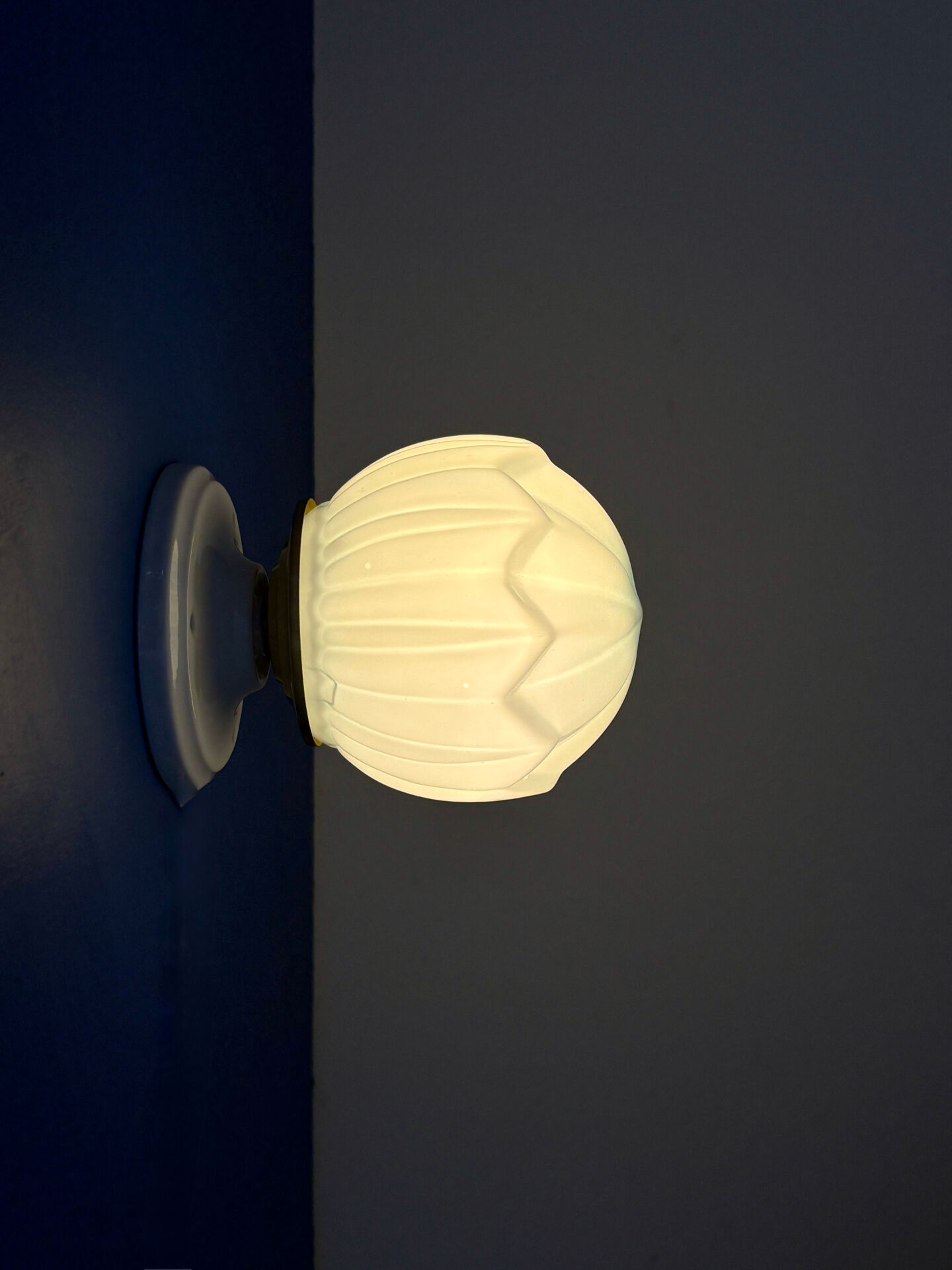 Vintage Art Deco globe wall light in blue opaline.