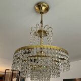 Cascade chandelier with crystal and brass tassels