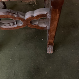 Antique wooden chair with upholstery