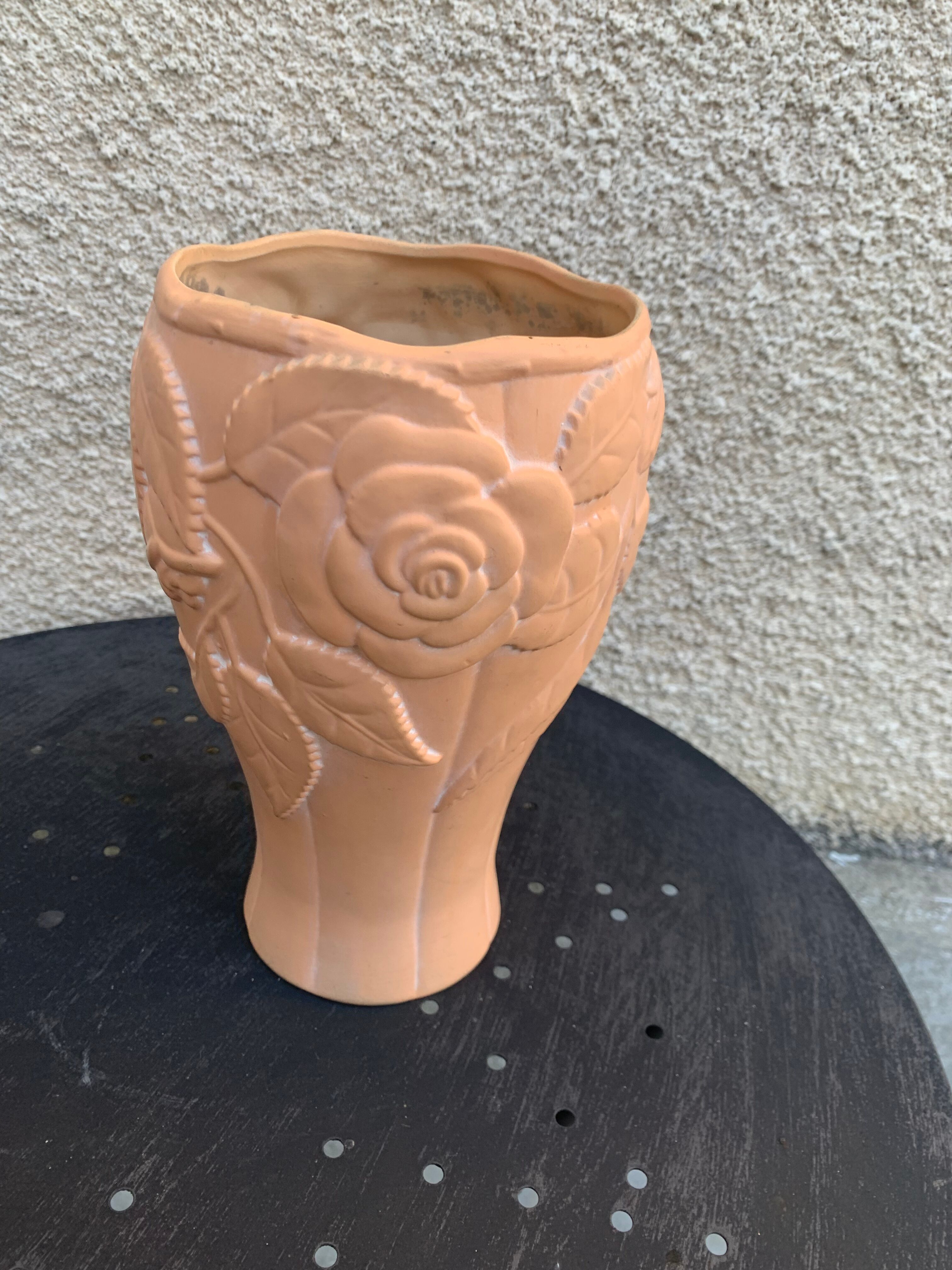 Terracotta vase with a vintage ceramic relief rose pattern