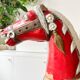 Large decorative rocking horse made of carved and hand-painted wood.