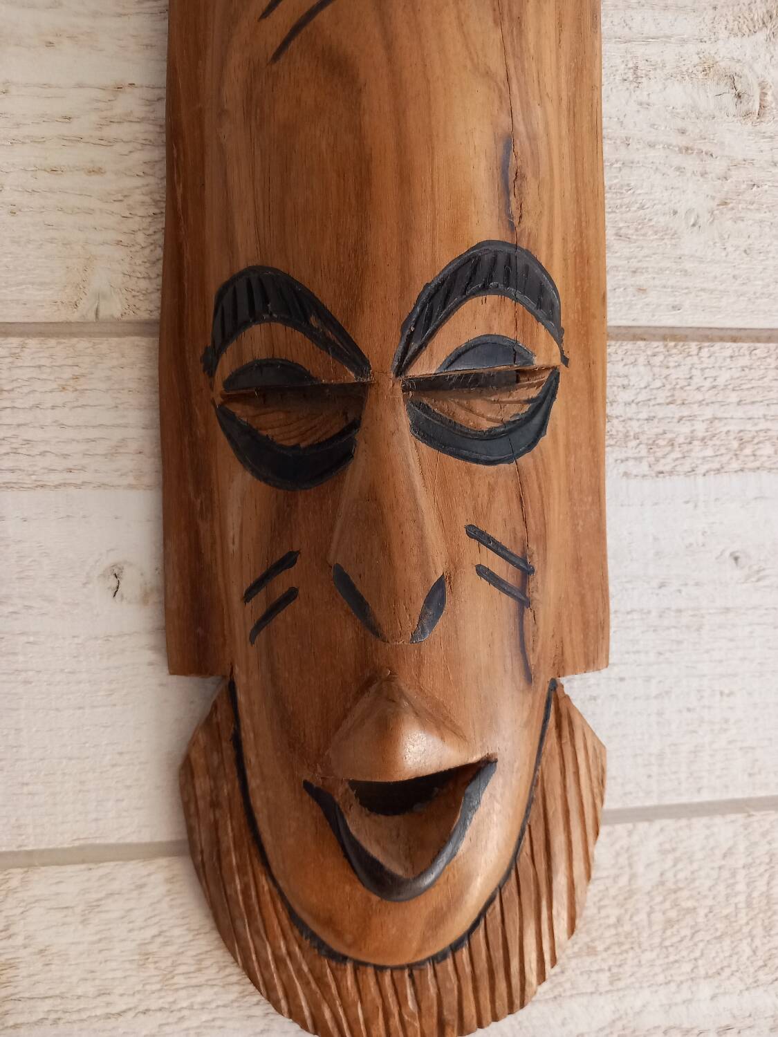 African mask in light wood
