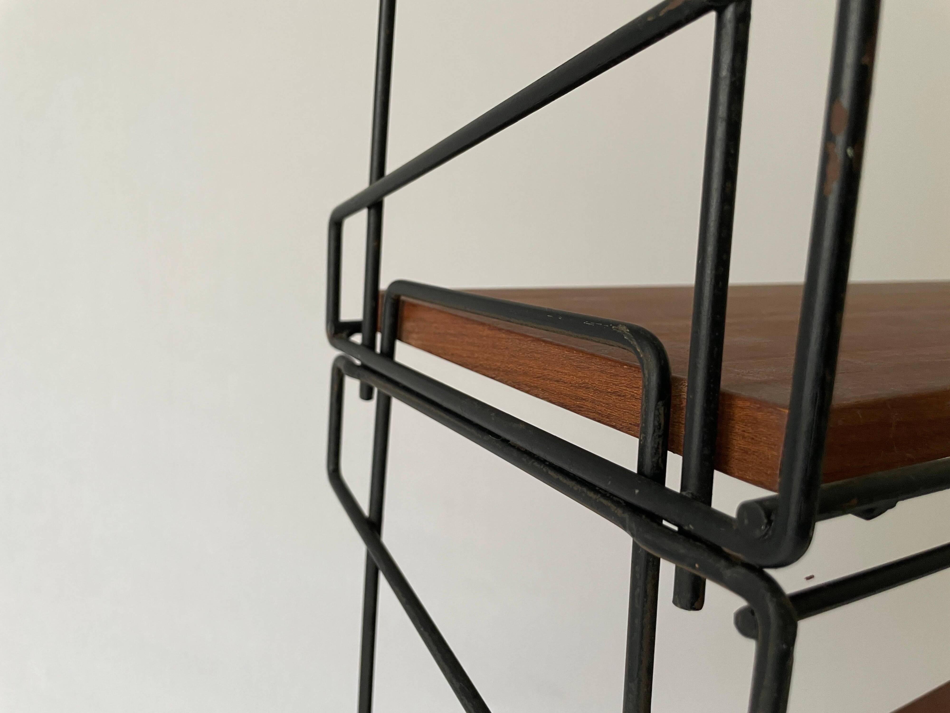 Free-standing shelf with a metal structure and 3 shelves, 1960s, Italy.