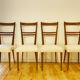 4 scandinavian chairs with seating in buckle fabrics