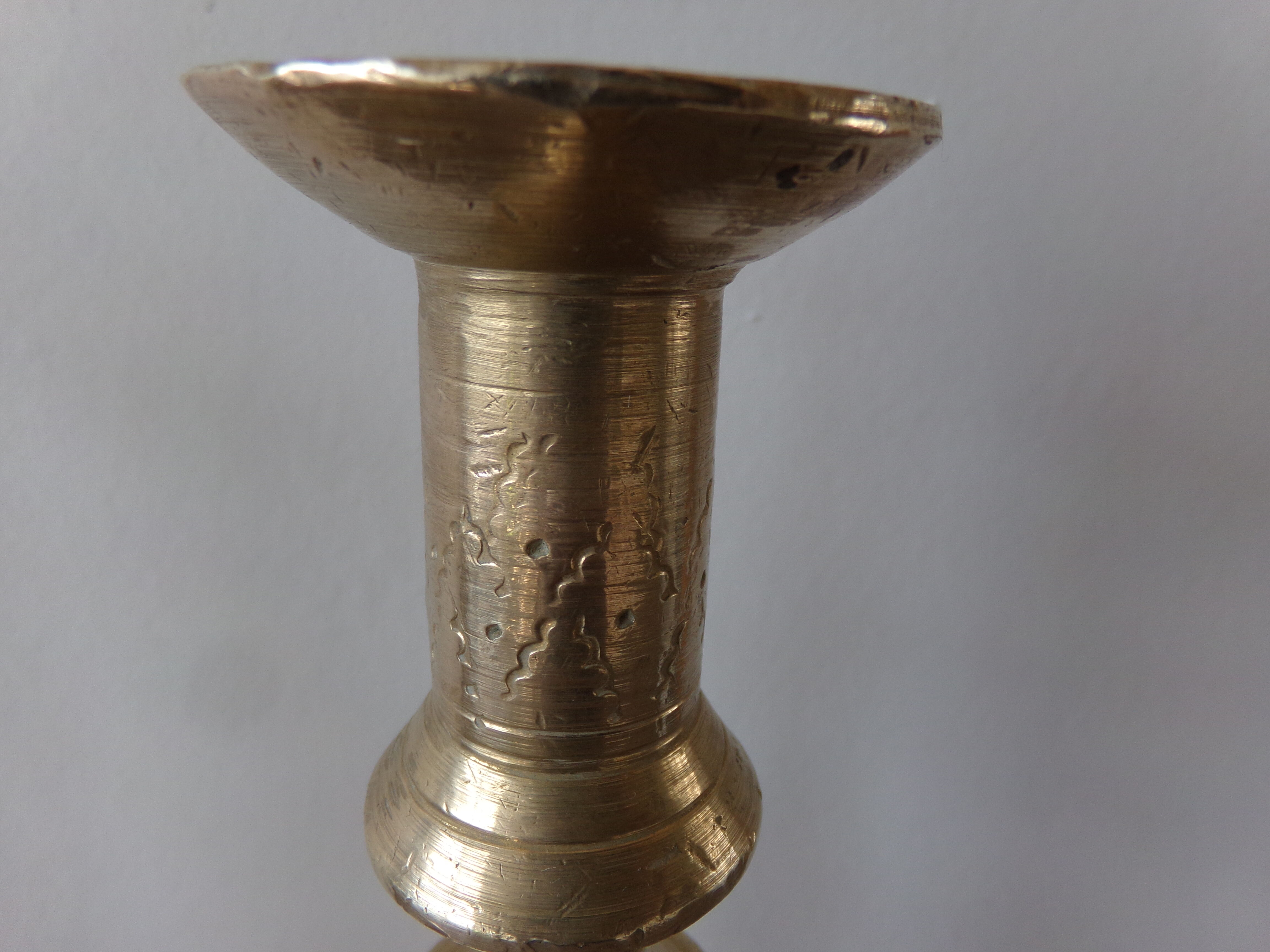Old candle holder in gilded bronze