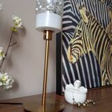 Table lamp with gold metal base and cylindrical textured glass shade