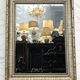 Mirror in a frame with a moulding.