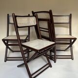 Set de quatre chaises pliantes en bois et cannage