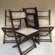 Set de quatre chaises pliantes en bois et cannage