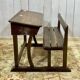 Early 20th-century oak school desk with porcelain inkwells