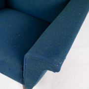 Armchair upholstered with dark blue wool fabric and legs in dark wood, of danish design, 1960s