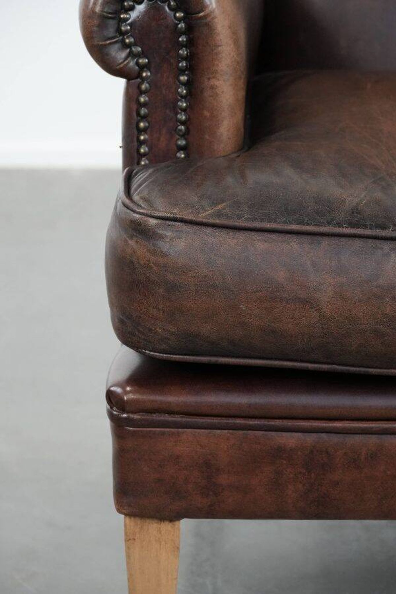 Characterful sheep leather armchair with a beautiful deep colour