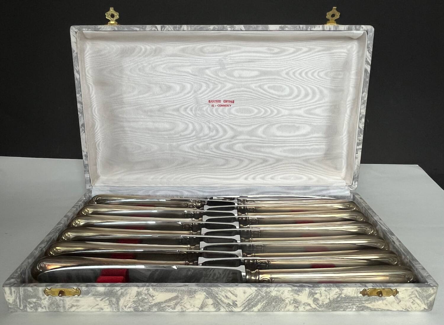 12 silver metal knives