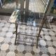 Vintage style side table with magazine holder, gold metal and glass top.
