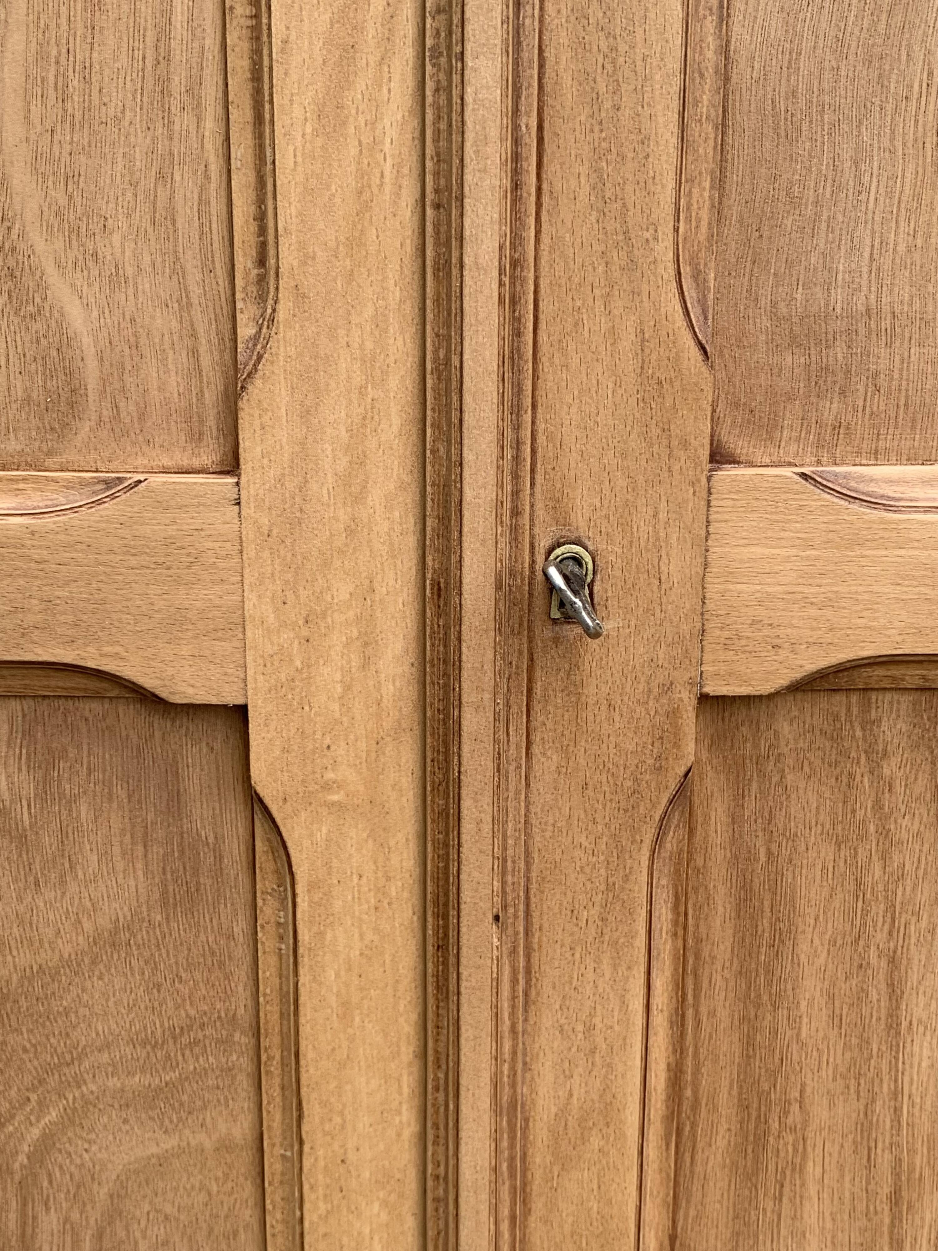 Parisian paneled cabinet in raw wood, 1940