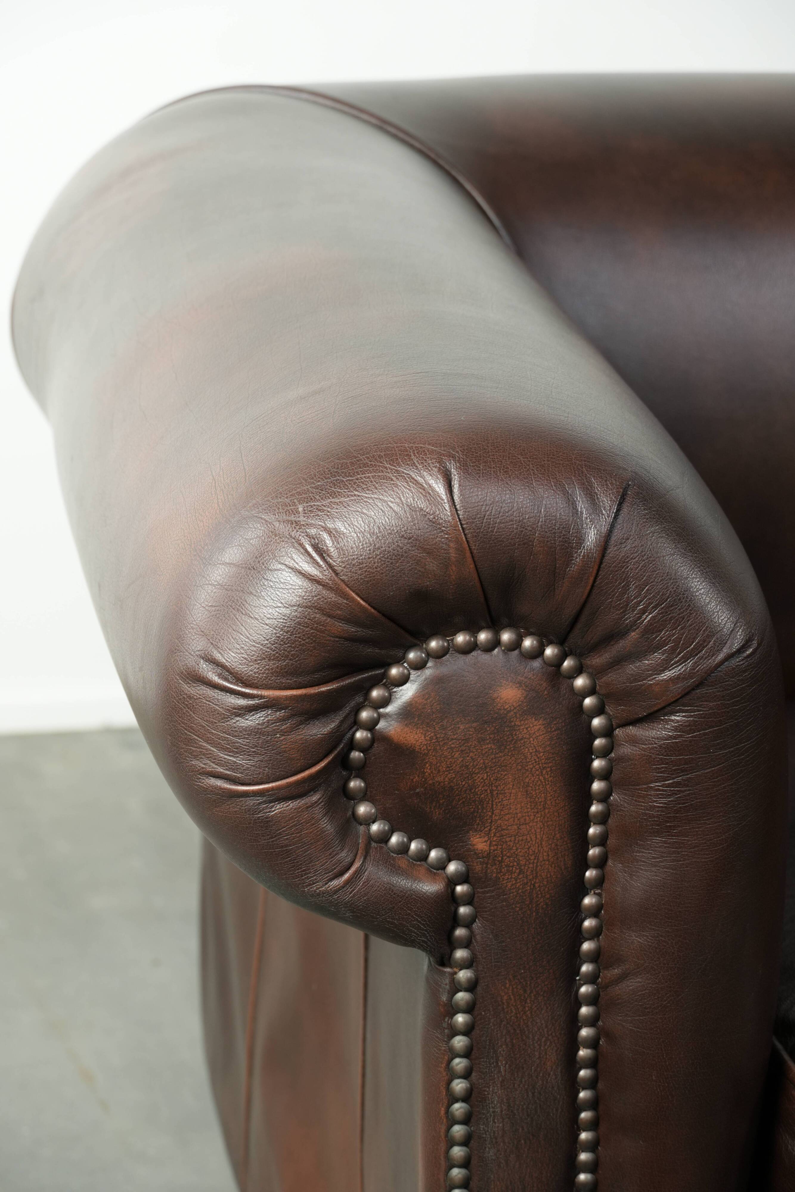 Luxury brown smooth cow leather Chesterfield sofa with an English look