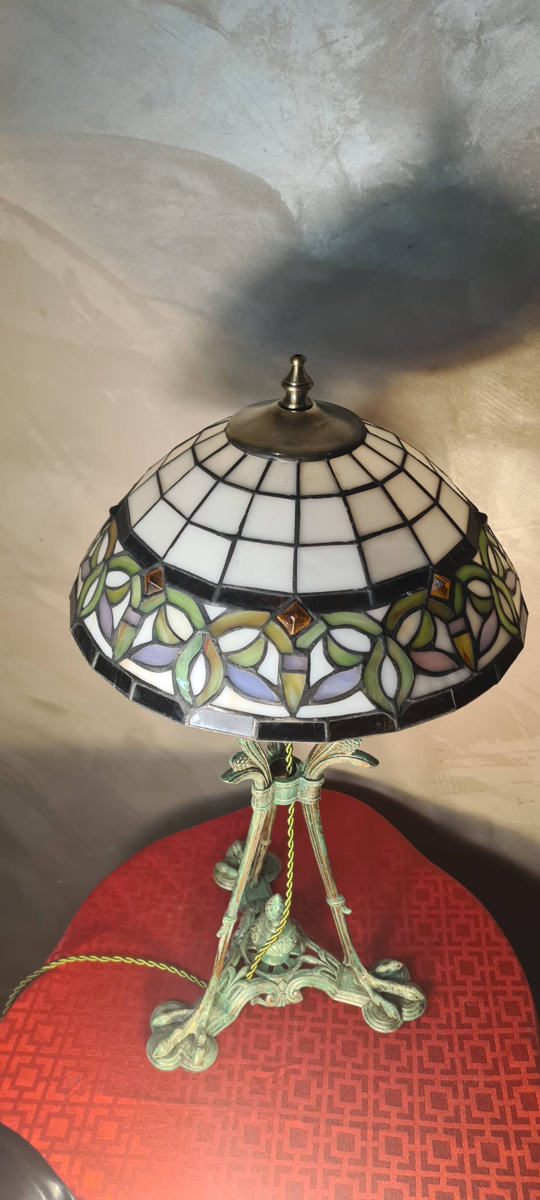 Antique patinated bronze regulator lamp with Tiffany glass shade in very good condition