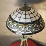 Antique patinated bronze regulator lamp with Tiffany glass shade in very good condition