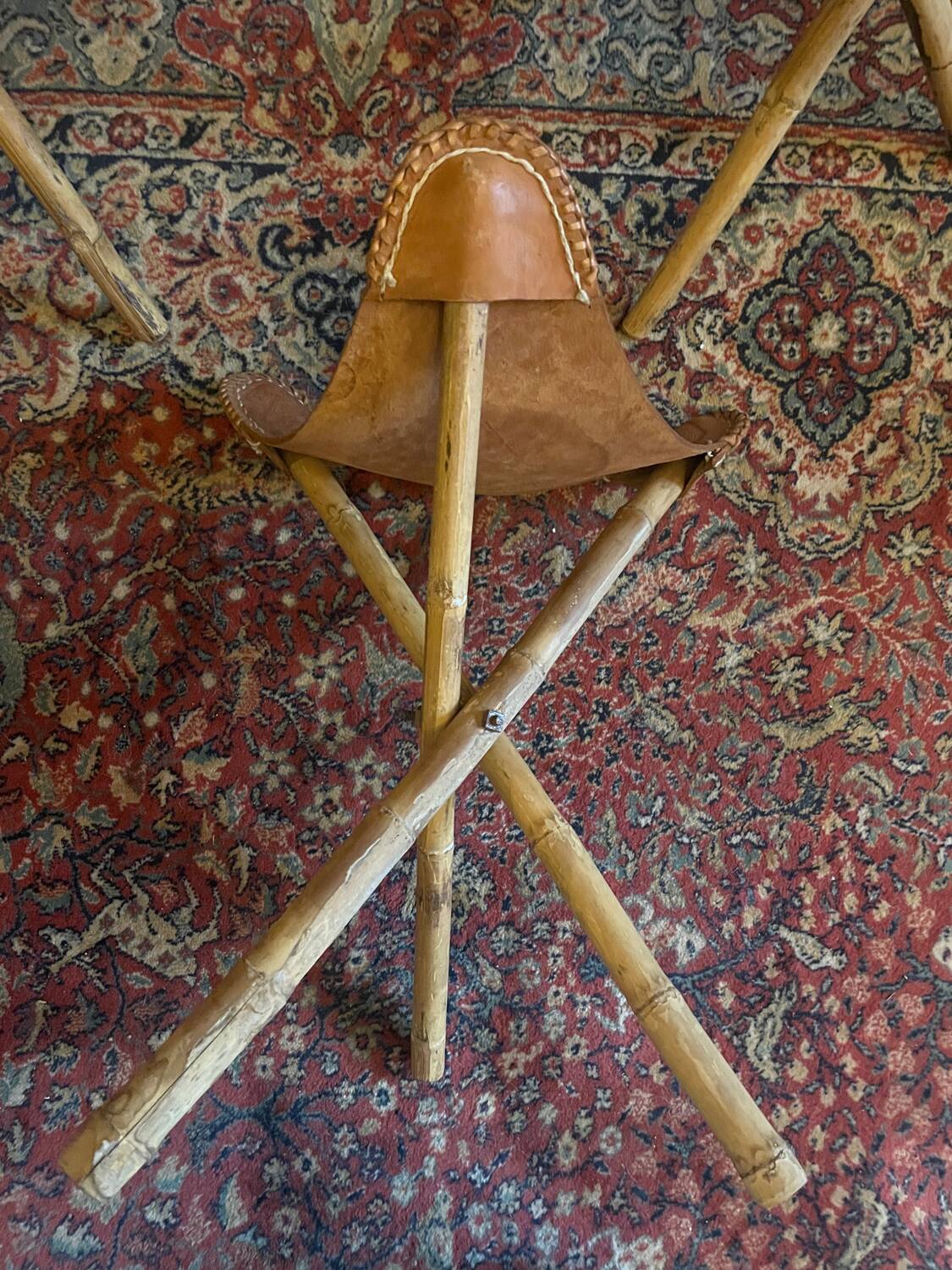 Vintage Mexican tripod stools in bamboo and leather.