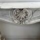 Louis XV style fireplace in veined white Carrara marble, 19th century.